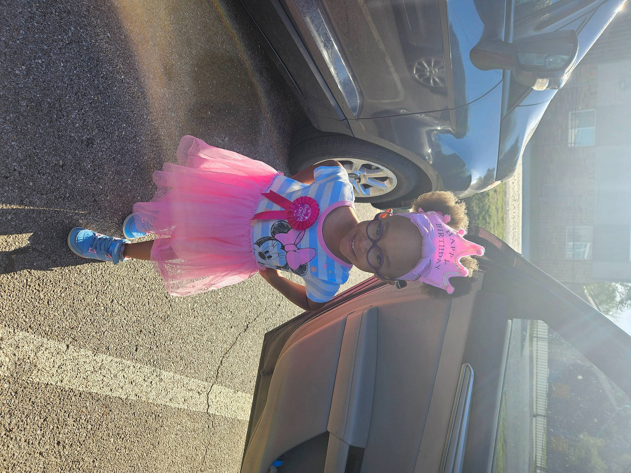 Keilah is registered to the contest to win money with this photo: auto_part, automotive_design, automotive_exterior, automotive_lighting, automotive_tire, automotive_wheel_system, bumper, car, electric_blue, fun, joy, magenta, mode_of_transport, motor_vehicle, person, tints_and_shades, tire, trunk, vehicle, vehicle_door