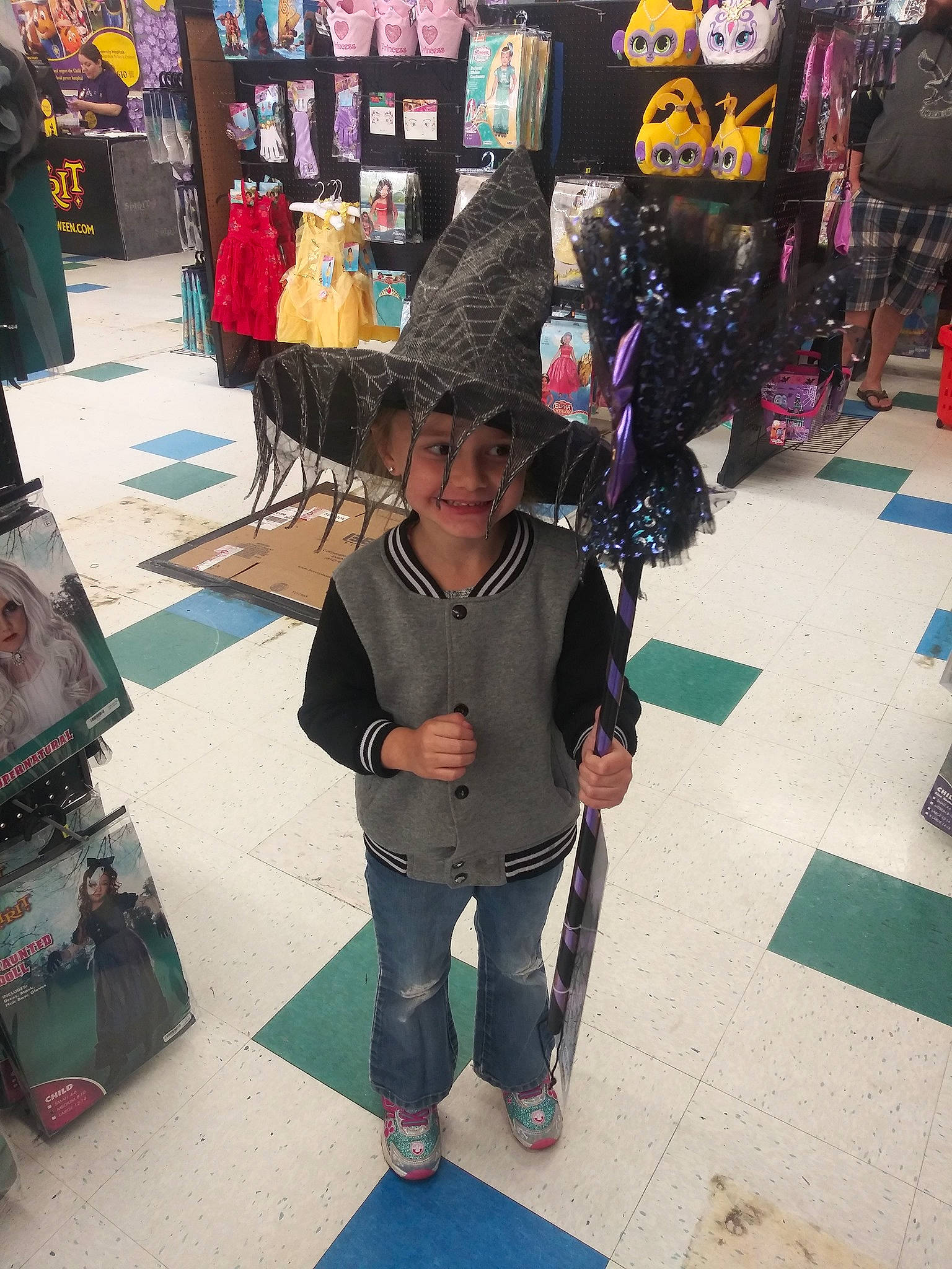 Hanna is registered to the contest to win money with this photo: art, black_hair, child, footwear, headwear, joy, person, shoe, shopping, snapshot, vacation