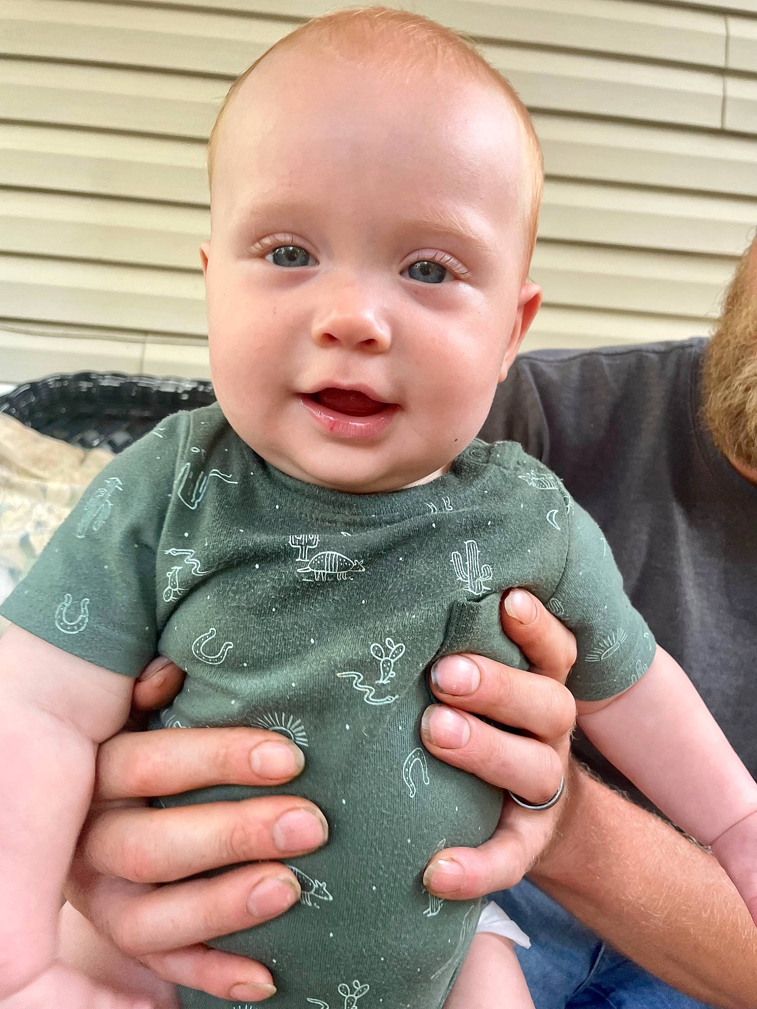 Cooper is registered to the contest to win money with this photo: arm, baby, baby_toddler_clothing, cheek, chest, child, eye, finger, gesture, grass, hand, happy, nail, pattern, person, skin, sleeve, smile, thumb, toddler