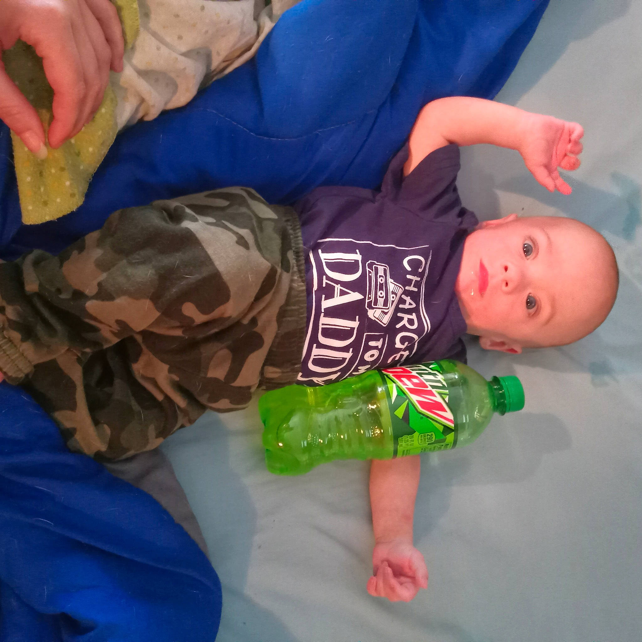 Callen is registered to the contest to win money with this photo: baby_toddler_clothing, chair, child, comfort, elbow, electric_blue, finger, flooring, fun, hand, joint, linens, person, room, sitting, sleeve, t_shirt, thigh, thumb, toddler