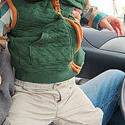 Hudson joined the competition — help win amazing prizes! toddler, child, person, face, clothing, vest, boots, pants, car, interior, seat, hand, jeans, curious, young, indoor, portrait, cute, expression, sitting
