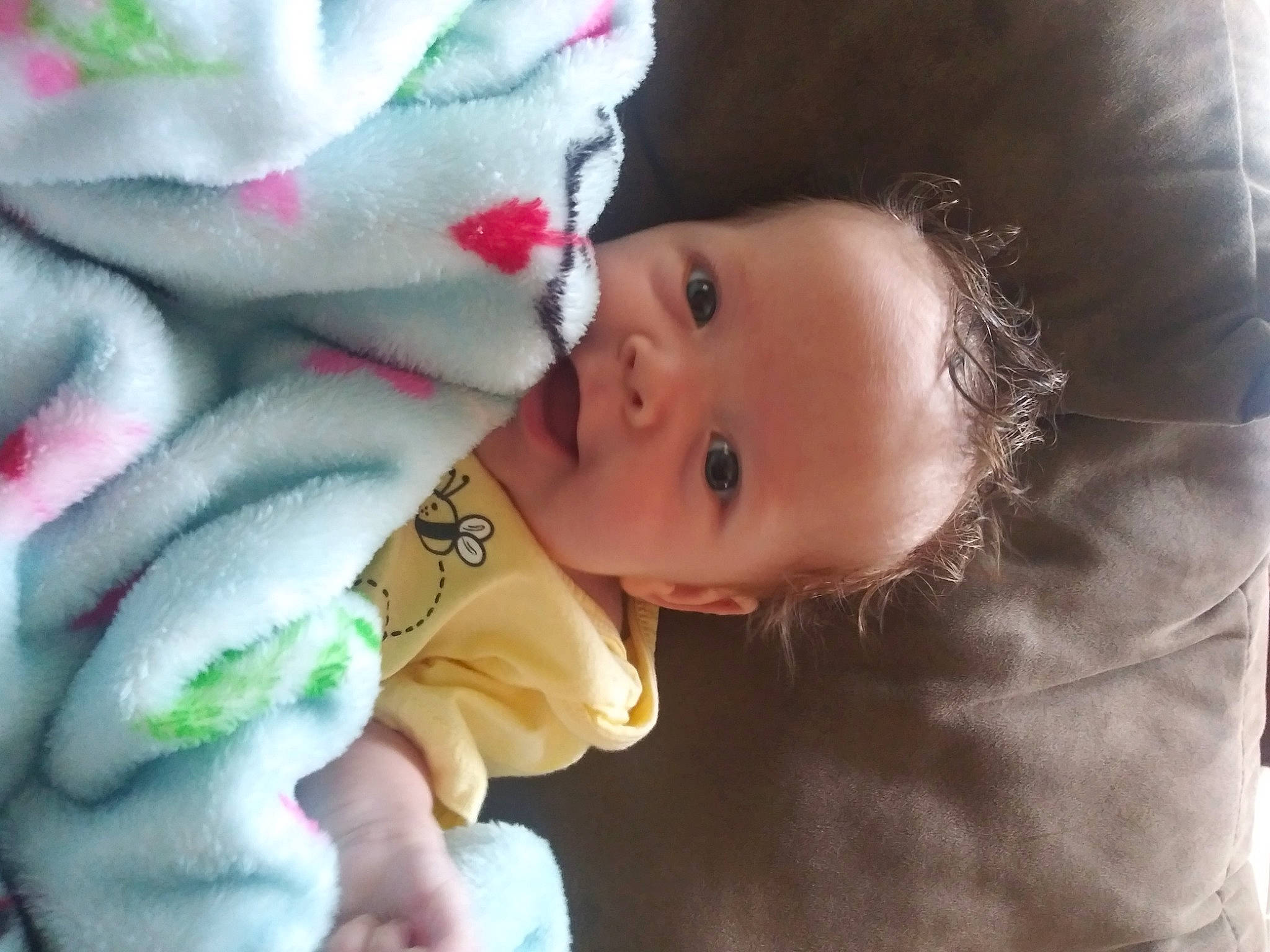 Arielle joined the competition — help win amazing prizes! baby, baby_toddler_clothing, carmine, cheek, child, comfort, facial_expression, finger, happy, linens, lip, mammal, mouth, nose, pattern, person, skin, smile, textile, toddler