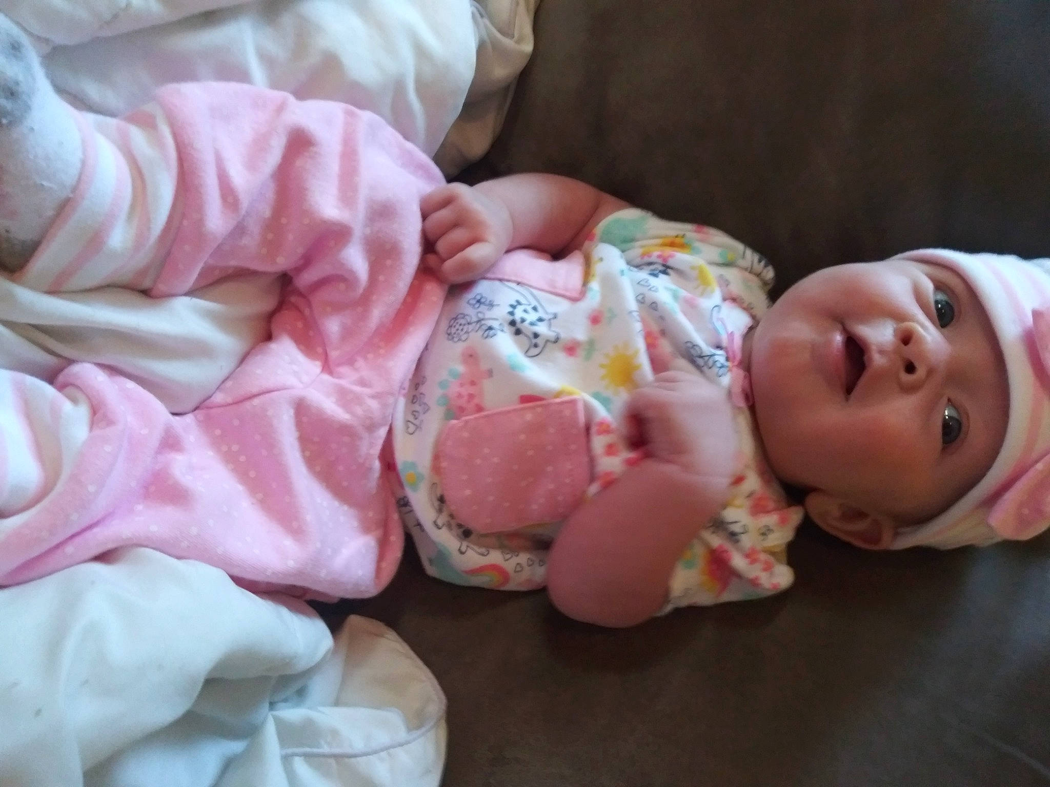 Arielle is registered to the contest to win money with this photo: baby, baby_products, baby_toddler_clothing, cheek, child, comfort, dress, event, flesh, happy, hat, headwear, nail, peach, person, pink, skin, sweetness, textile, toddler