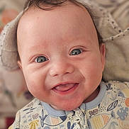 Helios participe au concours pour gagner de l'argent avec cette photo : baby, smiling, blue_eyes, face, infant, onesie, clothing, cute, happy, portrait, child, young, skin, hair, mouth, tongue, indoors, closeup, expression, person