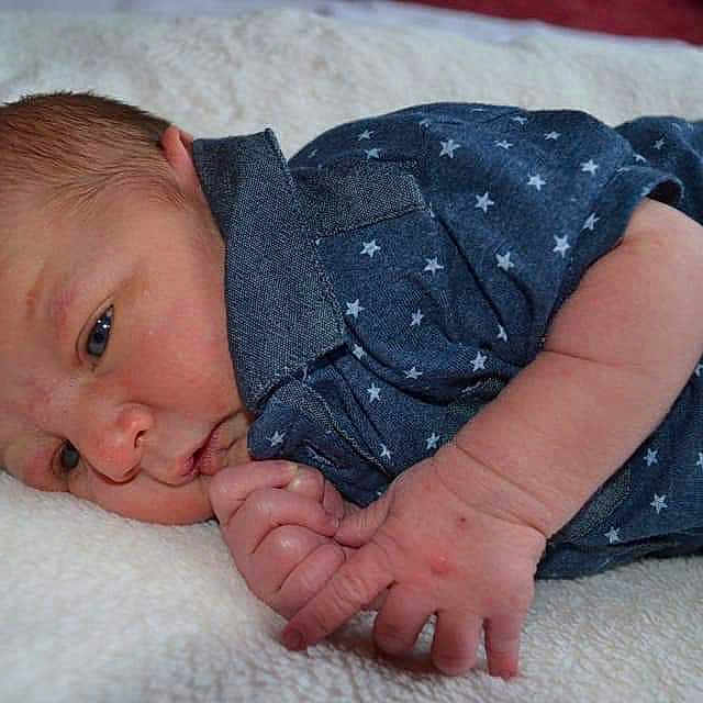 Taylor is registered to the contest to win money with this photo: arm, baby, cheek, child, finger, gesture, hand, leg, mouth, muscle, nail, person, skin, thumb, toddler