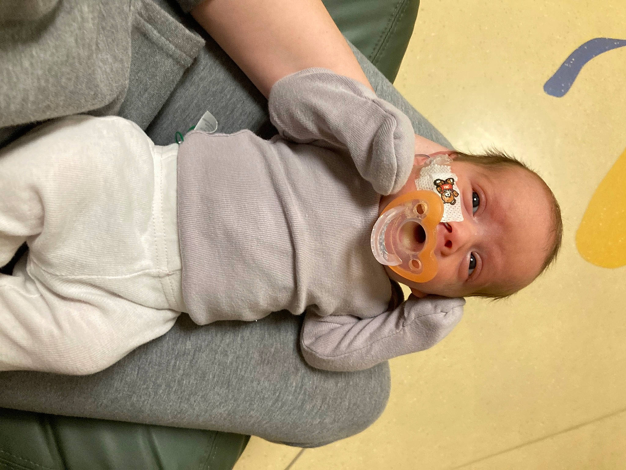 Colter is registered to the contest to win money with this photo: baby, baby_products, cheek, child, comfort, ear, elbow, finger, gesture, glasses, human_body, human_leg, joint, mouth, nail, nose, person, skin, sleeve, toddler