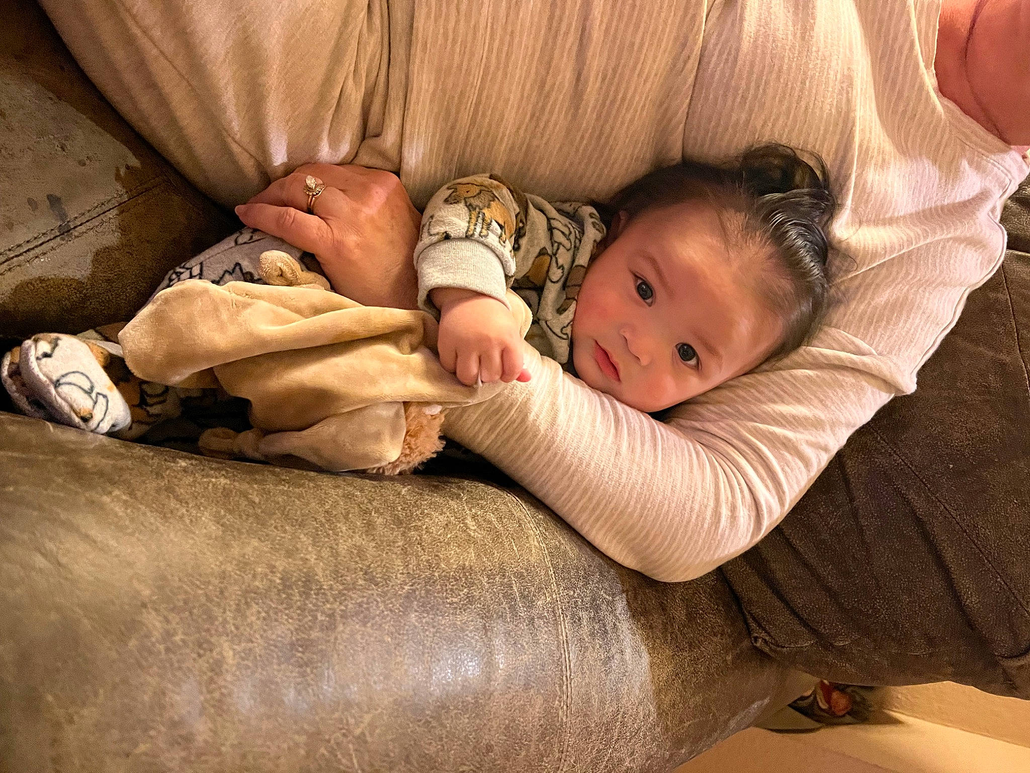 Maximus Sean is registered to the contest to win money with this photo: baby, baby_toddler_clothing, bedtime, child, comfort, couch, finger, floor, flooring, foot, hardwood, human_body, human_leg, joint, linens, person, sitting, skin, thigh, toddler