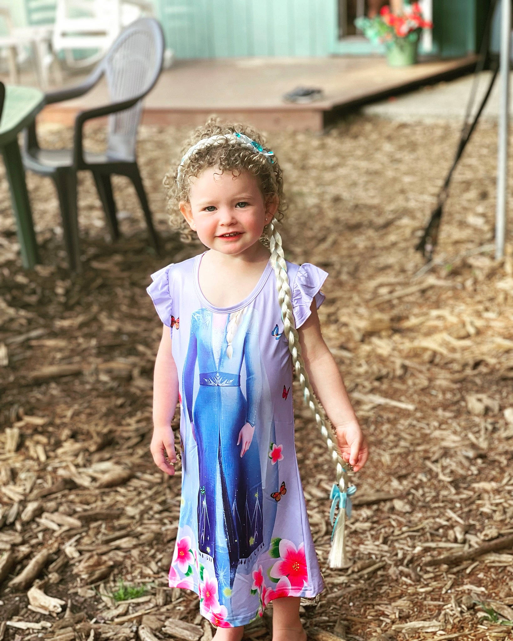 Eleanor is registered to the contest to win money with this photo: adaptation, chair, child, community, dress, electric_blue, event, fashion, fun, grass, green, hairstyle, happy, joy, leaf, leisure, people_in_nature, person, recreation, smile