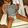 Columbia joined the competition — help win amazing prizes! toddler, child, striped_shirt, white_chair, toy_phone, curly_hair, bow, carpet, toy, colorful_toys, living_room, couch, pillow, blanket, indoor, playtime, diaper, furniture, person, cute