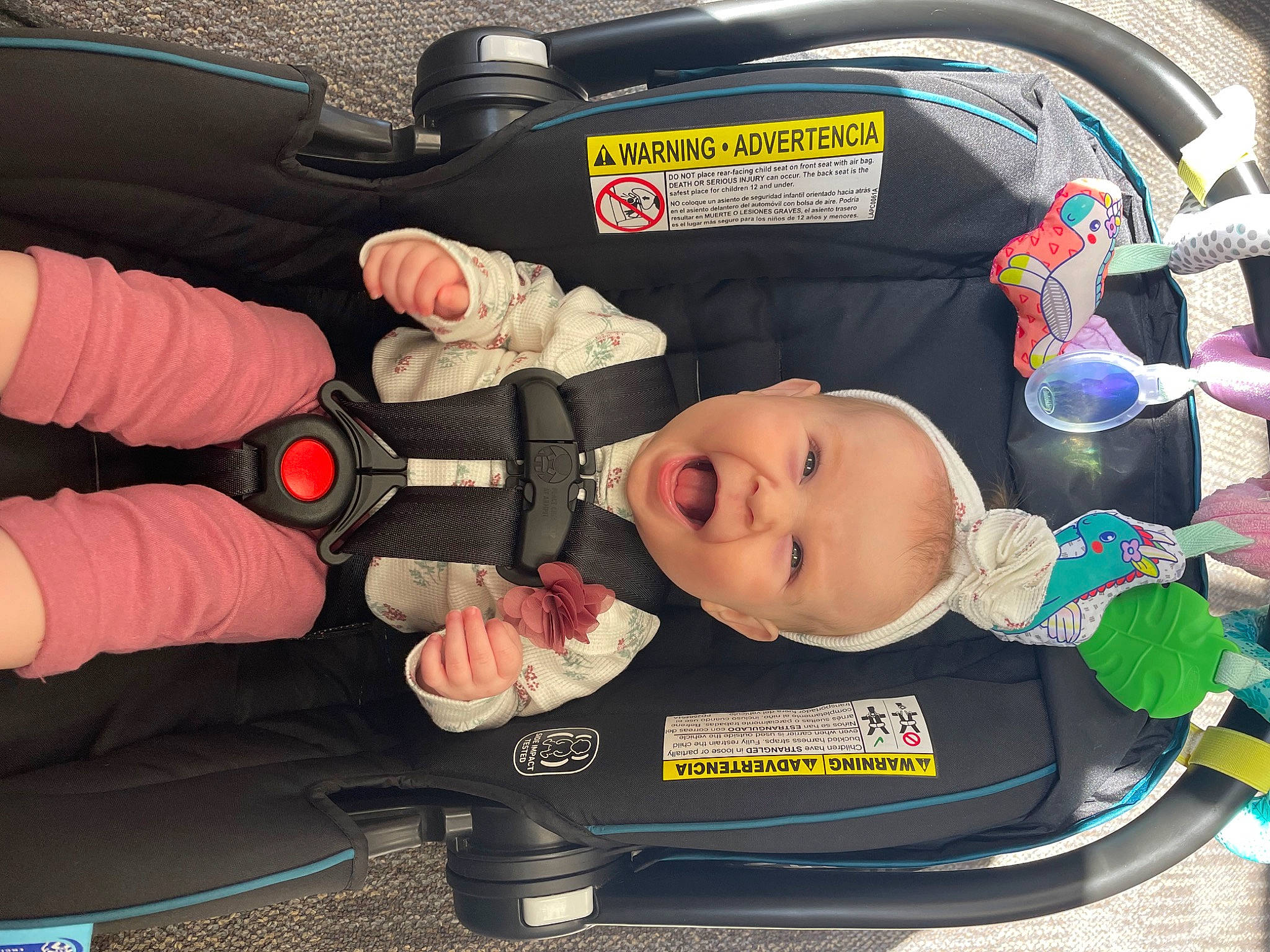 Eliza is registered to the contest to win money with this photo: auto_part, baby, baby_carriage, baby_products, baby_safety, baby_toddler_clothing, bag, car_seat, child, comfort, family_car, lap, motor_vehicle, person, plastic, service, smile, steering_wheel, toddler, travel