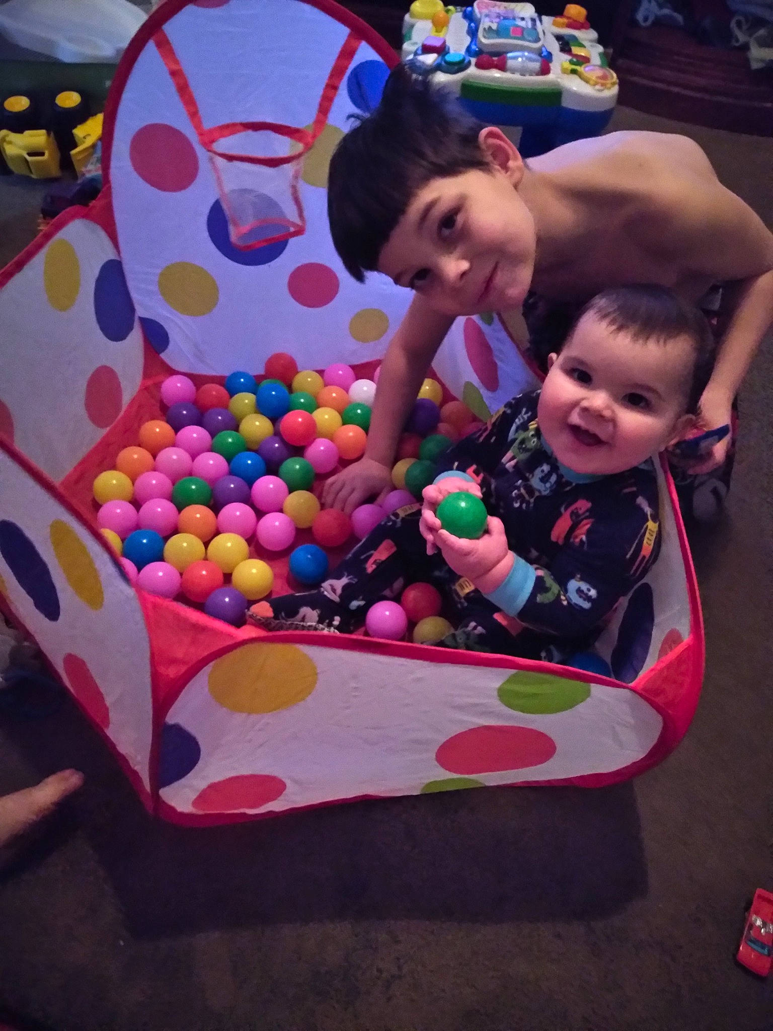 Christopher is registered to the contest to win money with this photo: baby_toys, ball_pit, child, fun, games, leisure, party, person, play, toddler, toy