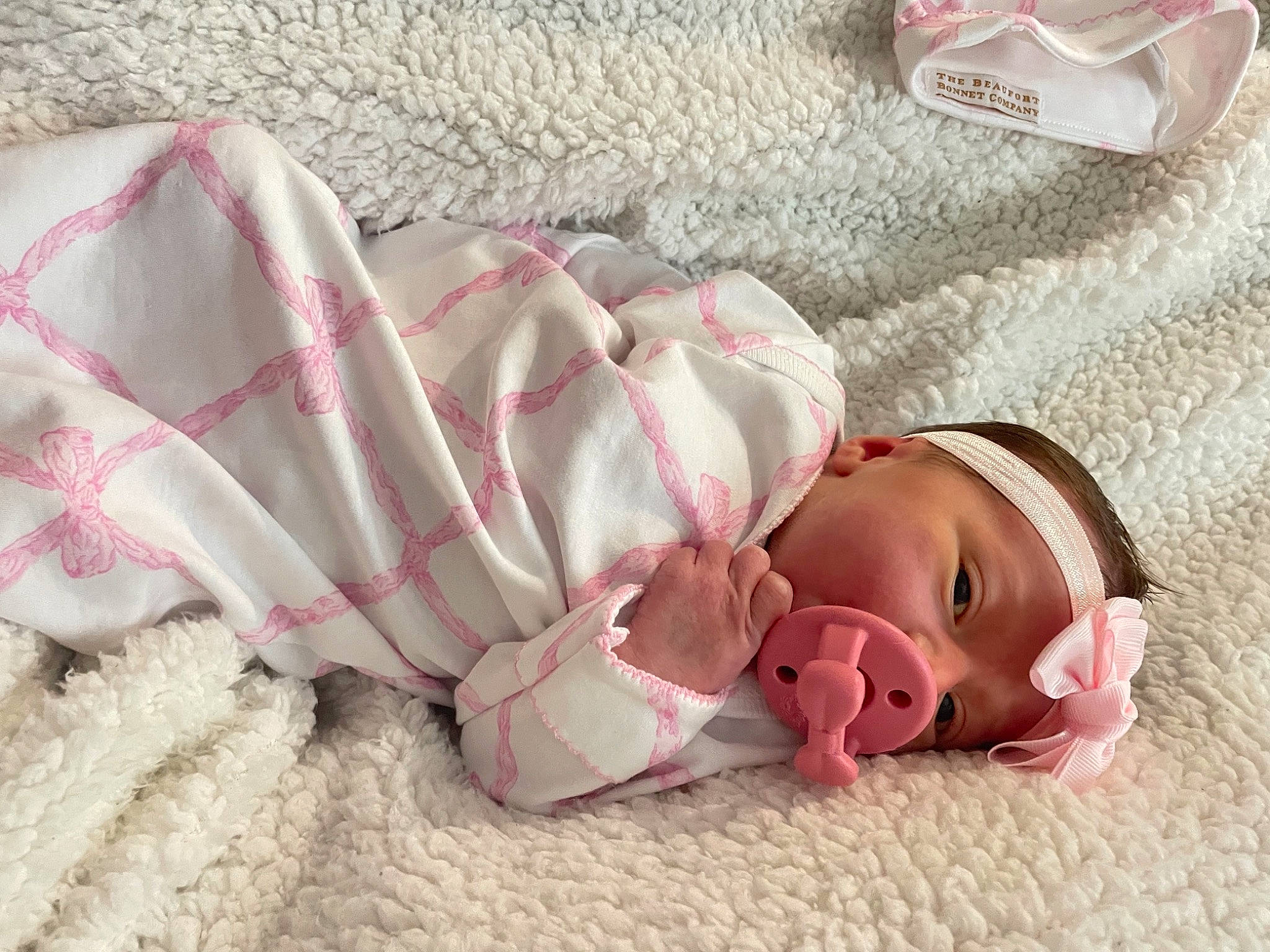 Wake-lynn is registered to the contest to win money with this photo: baby, baby_products, baby_toddler_clothing, bed_sheet, bedding, carmine, child, comfort, doll, fashion_accessory, flesh, foot, fur, headwear, linens, pattern, peach, person, pink, room