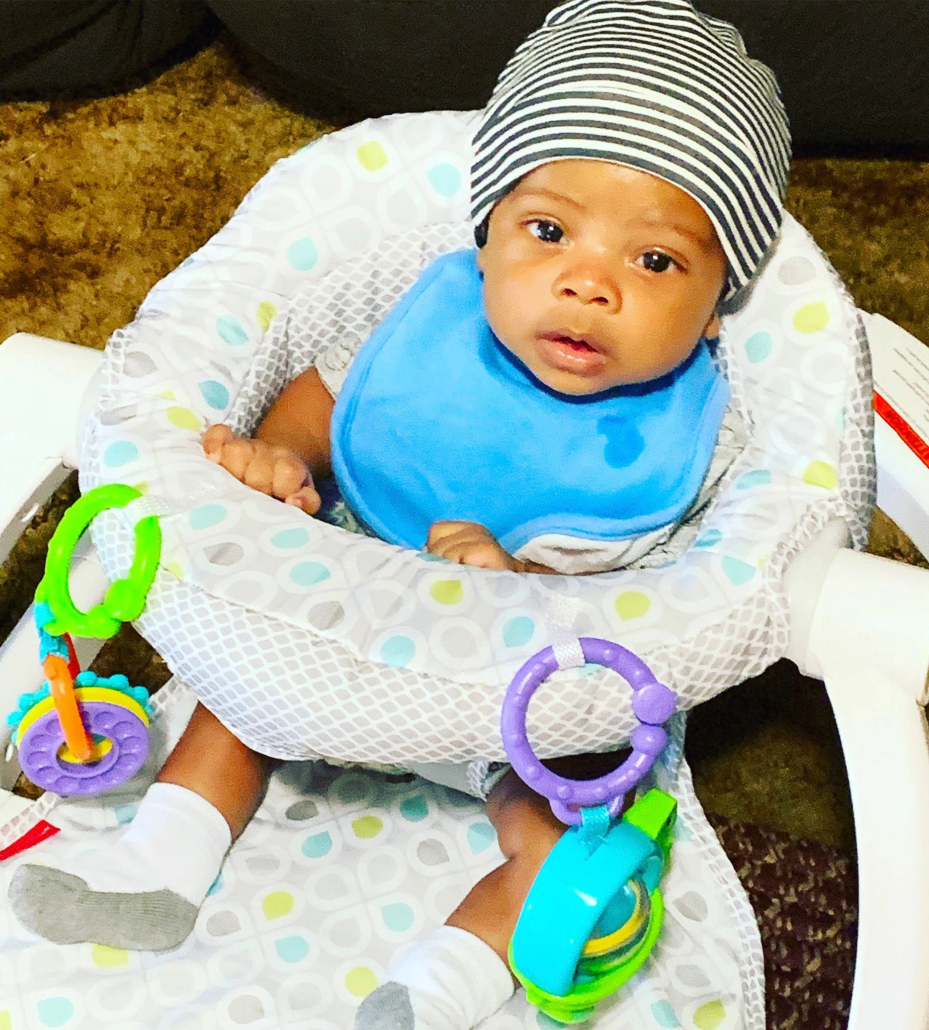 Perry is registered to the contest to win money with this photo: baby, baby_products, baby_safety, baby_sleeping, baby_toddler_clothing, cap, child, comfort, eye, face, happy, headwear, knit_cap, linens, person, pink, skin, sleeve, textile, toddler