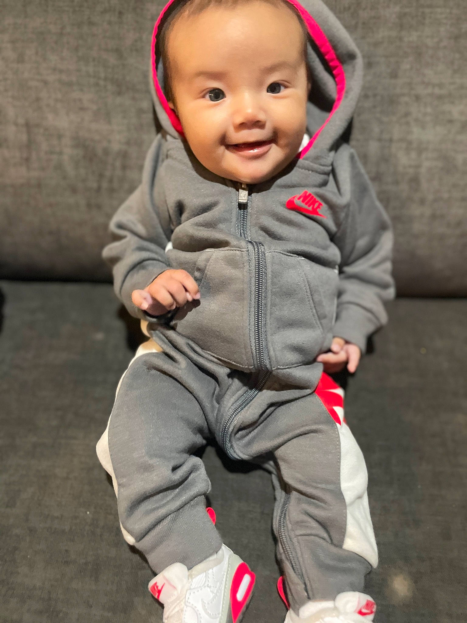 Milanya joined the competition — help win amazing prizes! baby, baby_toddler_clothing, carmine, cheek, chin, comfort, eye, face, flash_photography, flooring, fun, gesture, happy, head, joy, nose, person, sitting, skin, sleeve