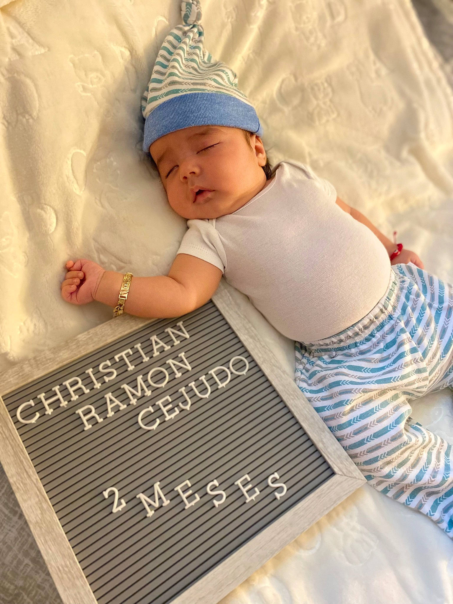 Christian joined the competition — help win amazing prizes! baby, baby_sleeping, baby_toddler_clothing, bedding, cap, child, comfort, fashion_accessory, flooring, font, happy, headwear, knit_cap, linens, nail, pattern, person, photo_caption, t_shirt, textile