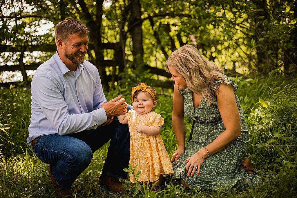 Vivian is registered to the contest to win money with this photo: flash_photography, forest, fun, gesture, grass, happy, interaction, joy, landscape, leisure, meadow, morning, natural_landscape, people_in_nature, person, plant, smile, summer, sunlight, toddler