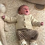 baby, bear_booties, bedding, child, clothing, cozy, cute, fabric_texture, infant, knitted_cardigan, leafy_pattern, lying_down, mouth_open, newborn, nursery, plush_toy, portrait, relaxed, soft_toy, stuffed_animal