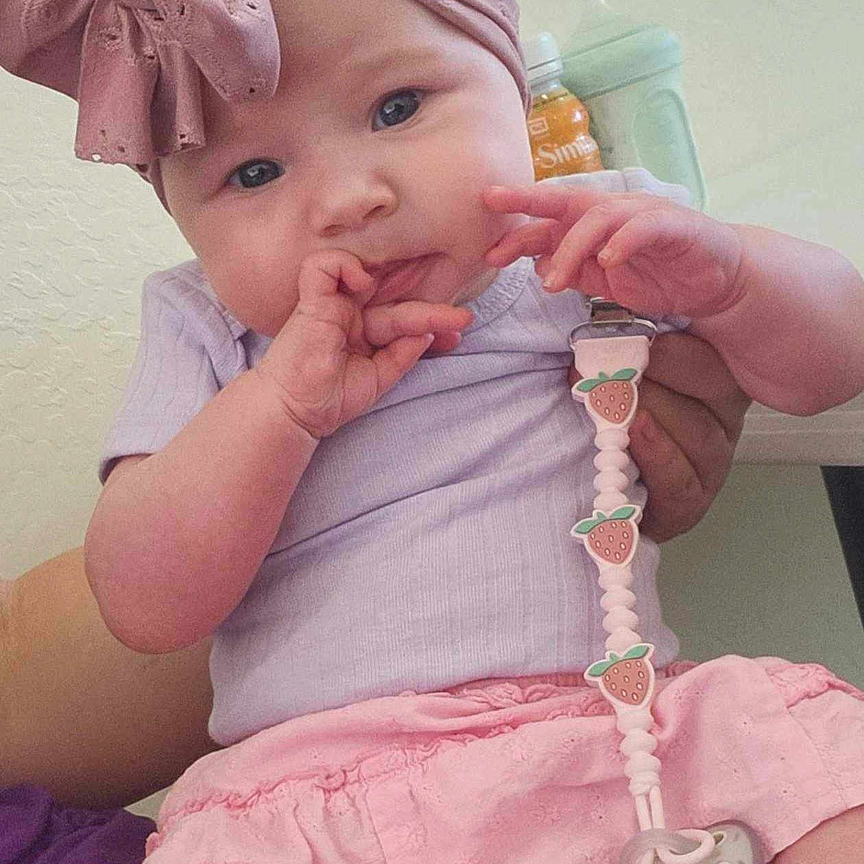 Autumn joined the competition — help win amazing prizes! baby, bottle, child, clothing, curious, cute, face, hand, headband, holding, indoor, infant, pacifier, pacifier_clip, person, pink, purple, sippy_cup, sitting, skirt