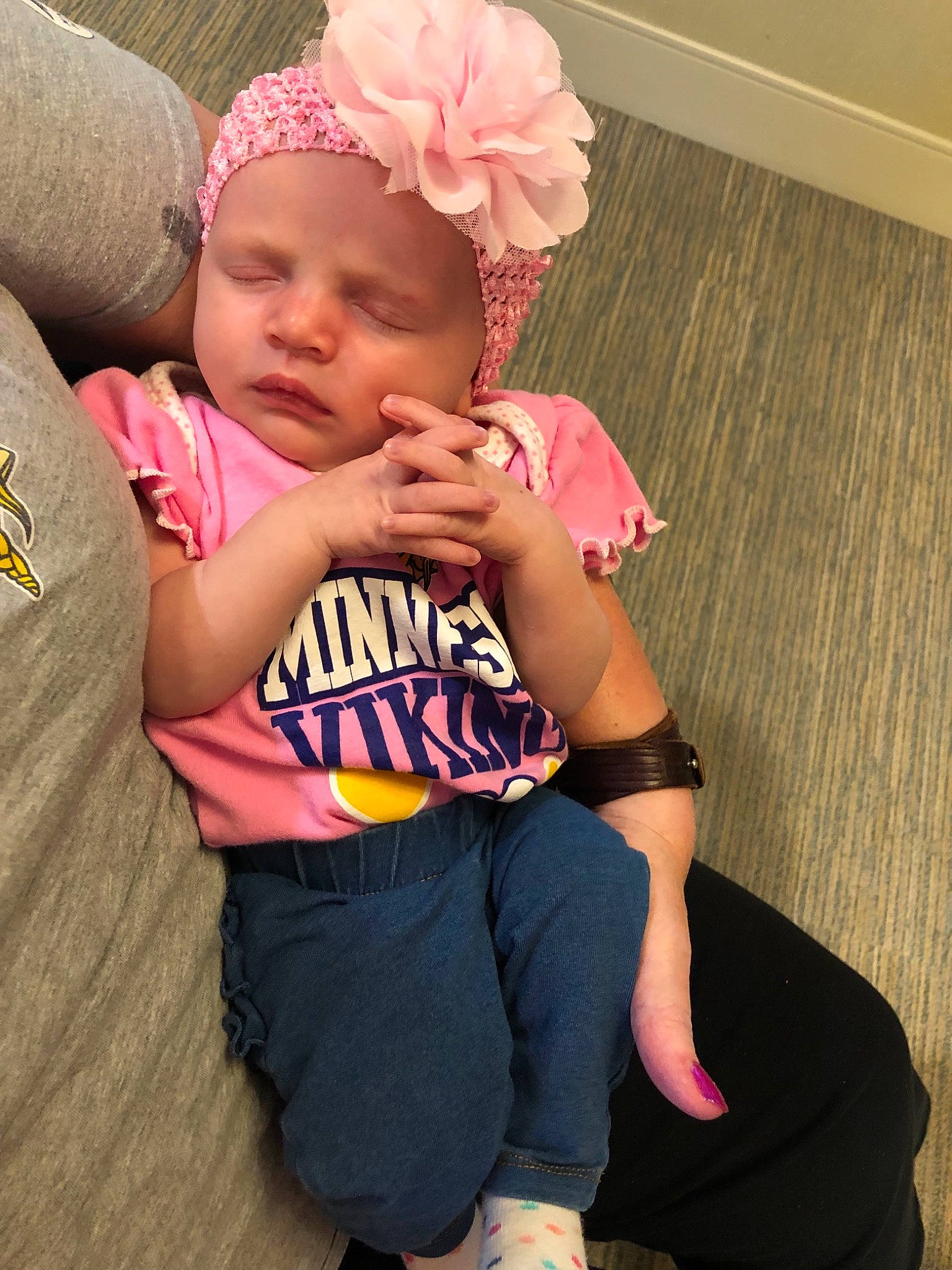 Allayah is registered to the contest to win money with this photo: arm, baby, baby_products, baby_toddler_clothing, child, cool, ear, fashion_accessory, finger, hair_accessory, headband, headgear, leg, person, pink, sitting, skin, sleeve, t_shirt, toddler