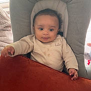 Ilyan participe au concours pour gagner de l'argent avec cette photo : baby, chair, child, clothing, cozy, curious, cushion, expression, face, hand, indoors, infant, light, person, pillow, seated, soft_furniture, striped_cloth, sweater, window