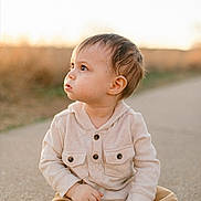 Lorenzo joined the competition — help win amazing prizes! toddler, child, sitting, outdoor, path, curious, golden_hour, casual_clothing, hoodie, pants, portrait, natural_light, daytime, young_child, cute, baby, looking_away, person, skin, hair