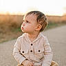 toddler, child, sitting, outdoor, path, curious, golden_hour, casual_clothing, hoodie, pants, portrait, natural_light, daytime, young_child, cute, baby, looking_away, person, skin, hair