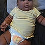 baby, infant, diaper, yellow_shirt, lying_down, blanket, soft_texture, sparkle_effect, cute, chubby, child, indoors, comfort, relaxing, portrait, smiling, skin, face, arm, leg