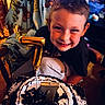birthday, cake, candle, celebration, chair, child, chocolate, clothing, dessert, face, food, happy, icing, indoor, number_seven, party, person, smiling, table, young_boy