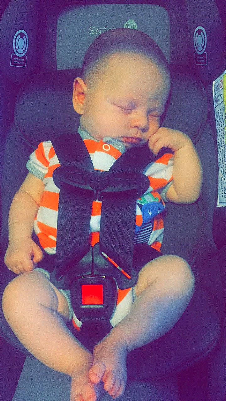 Lawson is registered to the contest to win money with this photo: arm, baby, car_seat, child, neck, person, play, product, sitting, toddler