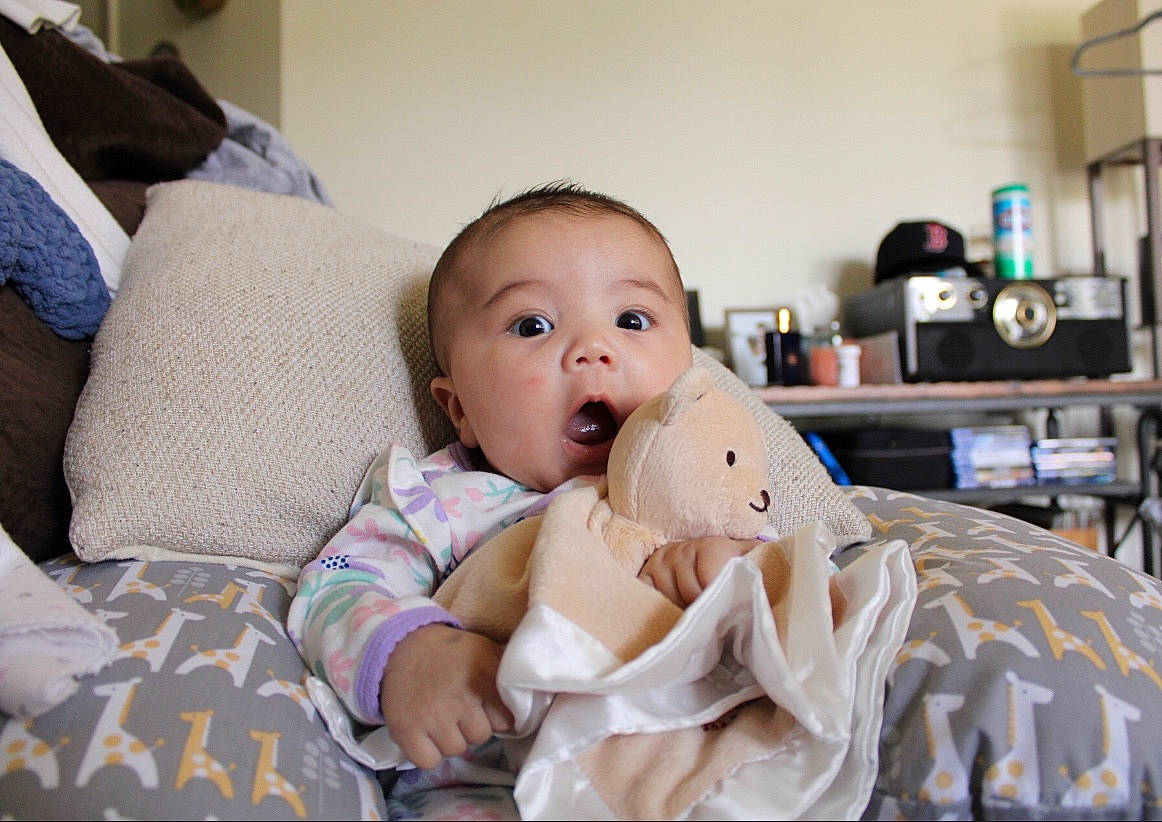 Nora is registered to the contest to win money with this photo: baby, child, comfort, furniture, person, room, surprise, toddler