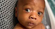 Javeon joined the competition — help win amazing prizes! baby, infant, child, face, skin, eyes, expression, seat, perforated, closeup, portrait, curious, surprised, indoor, human, young, person, head, shoulders, naked