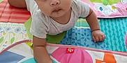 Aaliyah joined the competition — help win amazing prizes! baby, child, infant, play_mat, colorful, elephant, toy, floor, wooden_floor, cute, hand, white_shirt, indoors, smiling, face, person, toddler, curious, bright, playtime
