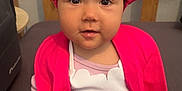Ange a rejoint le concours — aidez-le/la à gagner de superbes lots ! apparel, baby, bonnet, child, closeup, curious, cushion, cute, face, happy, indoor, infant, person, pink_clothing, plush, portrait, sitting, tights, wooden_background, young_child