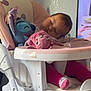 baby, blanket, child, cute, face, furniture, head, high_chair, home, indoor, legs, peaceful, person, pink_clothing, plush_toy, rest, sleeping, socks, television, toy