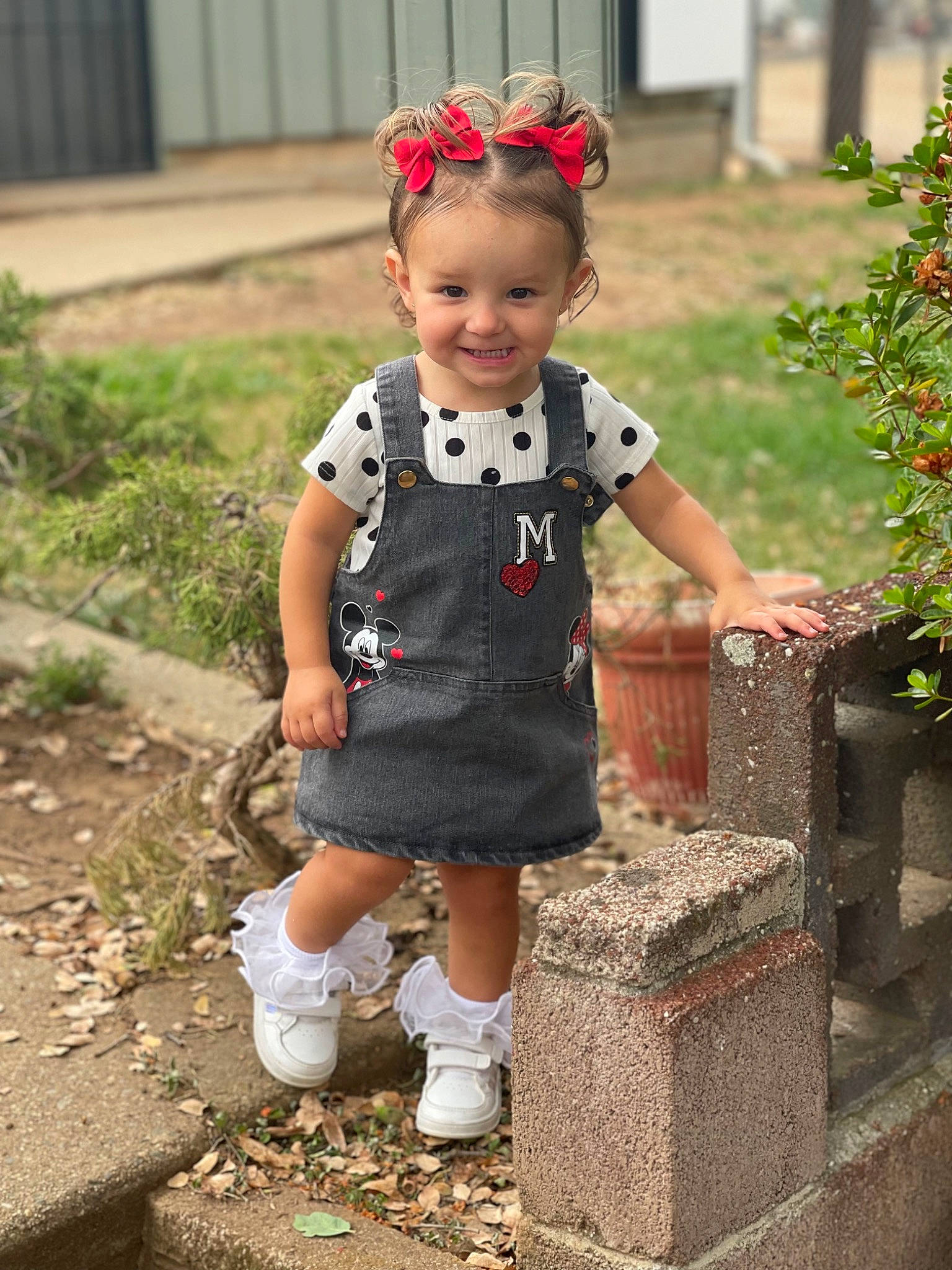 Oakley is registered to the contest to win money with this photo: baby, baby_toddler_clothing, beauty, child, eye, face, facial_expression, grass, hairstyle, happy, head, joy, person, photograph, plant, shoe, sleeve, smile, snapshot, sock