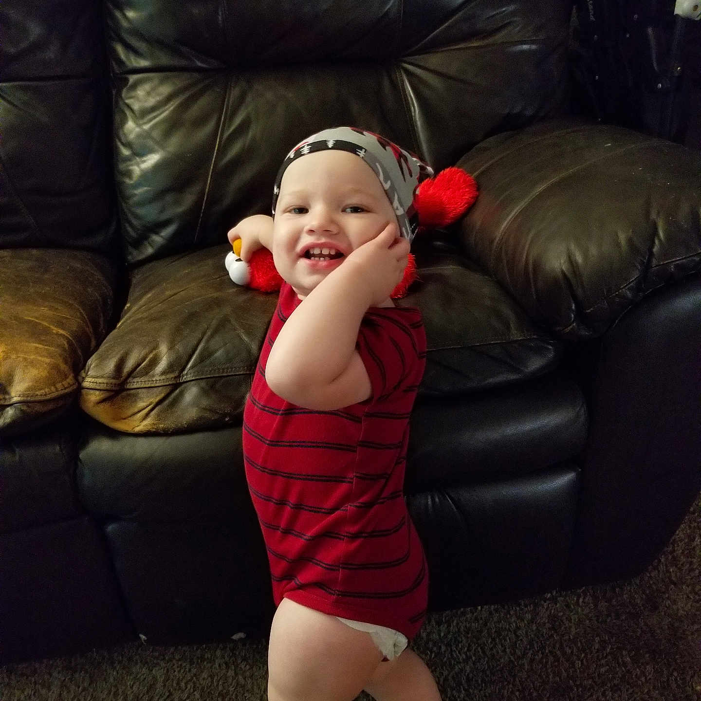 Carson is registered to the contest to win money with this photo: architecture, baby, bodypart, building, chair, clothing, couch, cushion, face, furniture, hat, head, homedecor, indoors, livingroom, person, photography, portrait, room, sitting