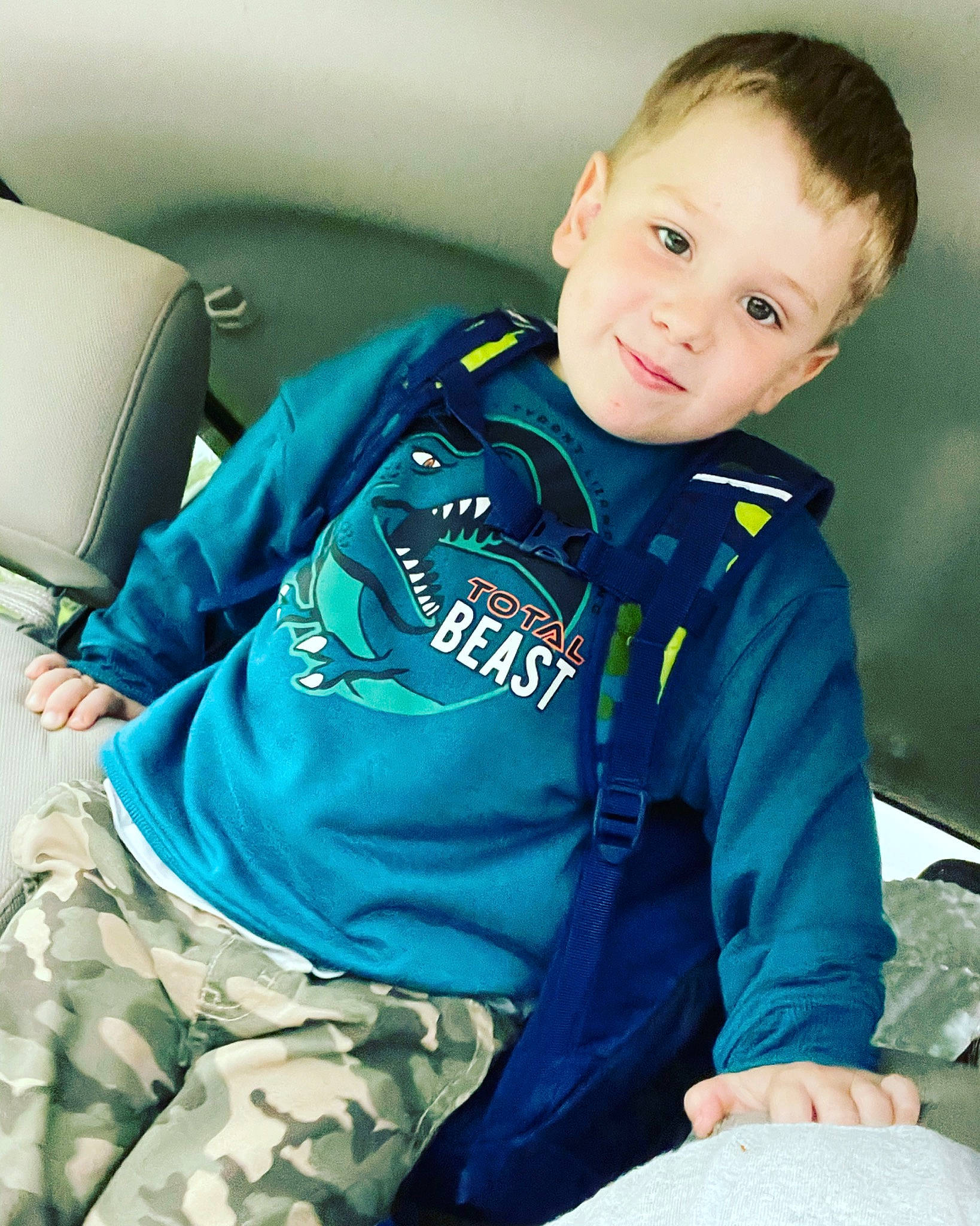 Raiden joined the competition — help win amazing prizes! baby_toddler_clothing, blond, car_seat, car_seat_cover, child, collar, comfort, cool, electric_blue, happy, joy, military_camouflage, military_person, outerwear, pattern, person, sitting, sleeve, t_shirt, toddler