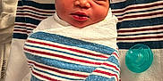 Jenesis is registered to the contest to win money with this photo: baby, bed, blanket, child, cute, fabric, face, hat, hospital, infant, newborn, pacifier, peaceful, person, resting, skin, sleeping, soft, swaddled, wrapped