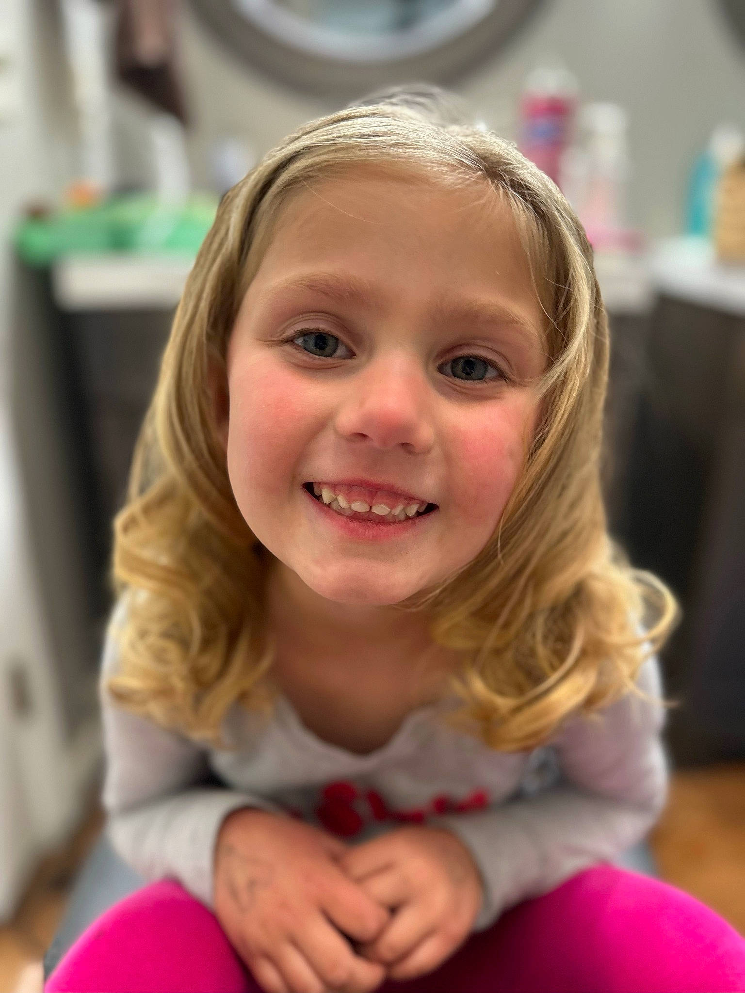 Harley is registered to the contest to win money with this photo: blond, brown_hair, chair, cheek, child, event, flooring, fun, hairstyle, happy, headwear, iris, joy, laugh, leisure, long_hair, person, play, room, sitting