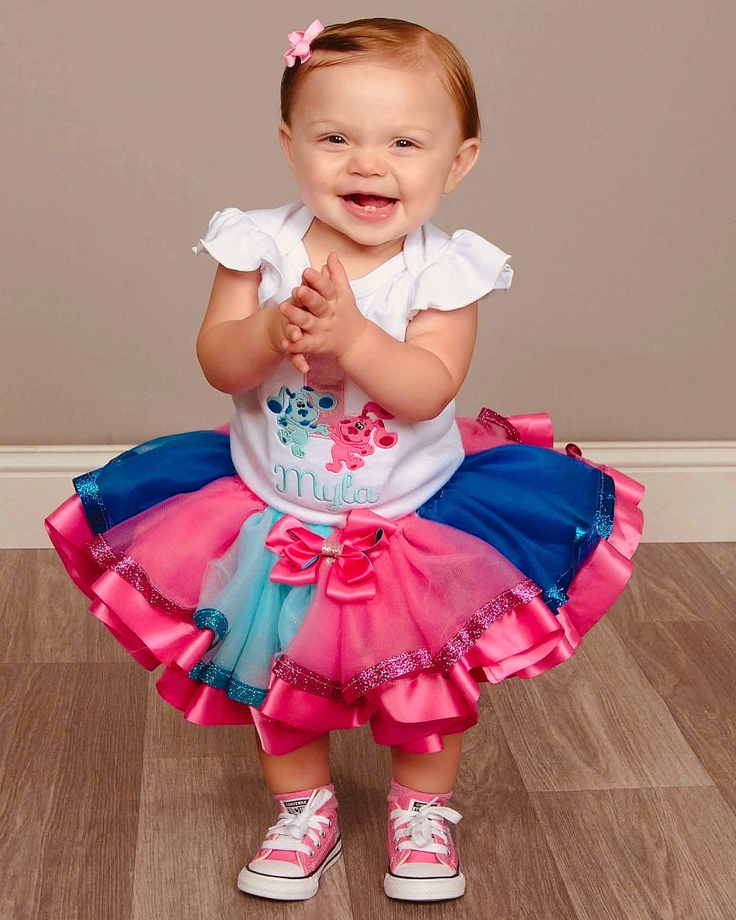 Myla joined the competition — help win amazing prizes! baby, baby_toddler_clothing, child, day_dress, dress, event, fashion_accessory, flash_photography, footwear, happy, hardwood, magenta, pattern, person, pink, purple, ruffle, shoe, sleeve, smile