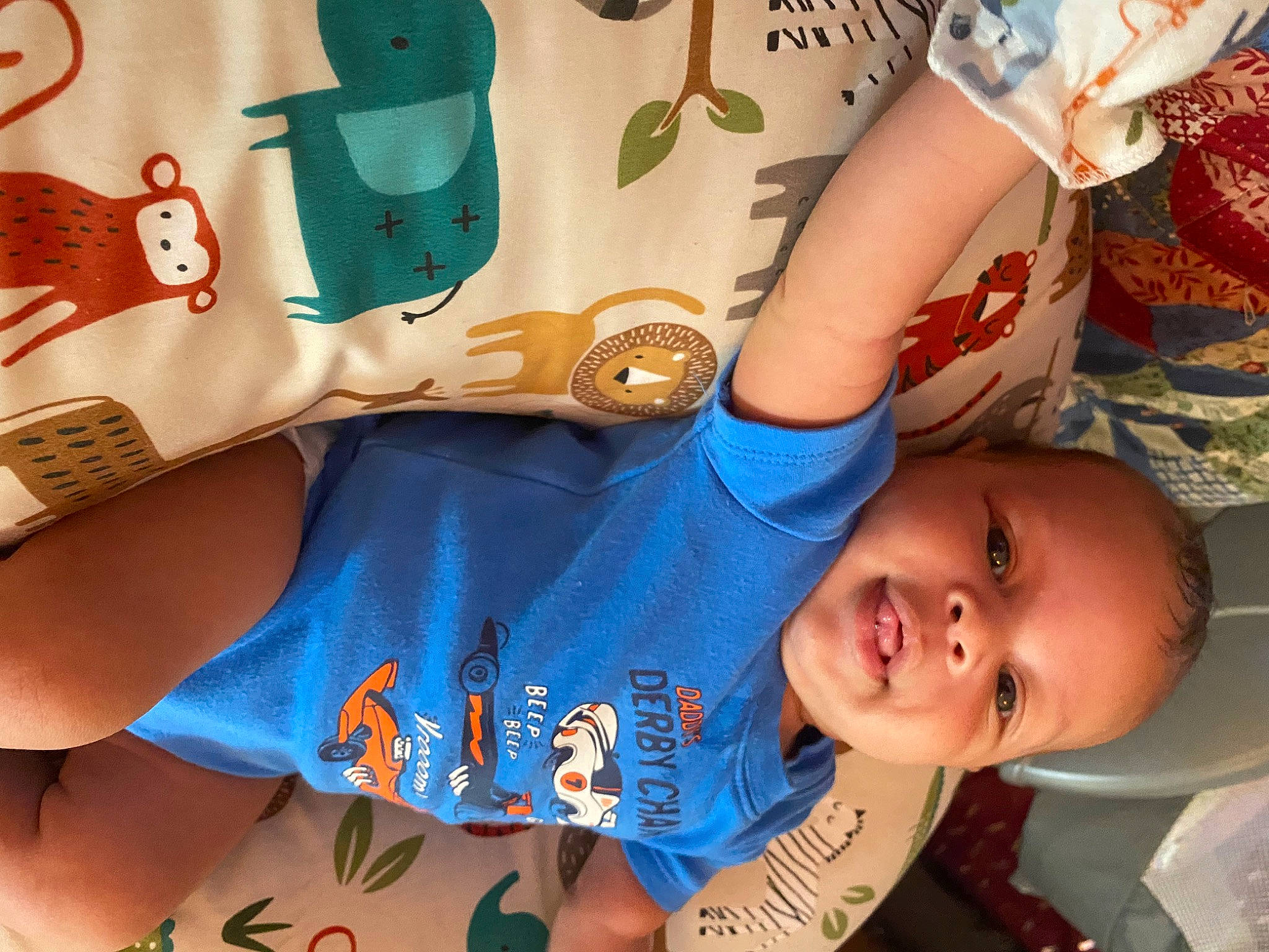 London is registered to the contest to win money with this photo: arm, azure, blue, coffee_cup, cup, drinkware, green, happy, human_body, leg, mammal, mouth, neck, organ, person, product, skin, smile, textile, vertebrate