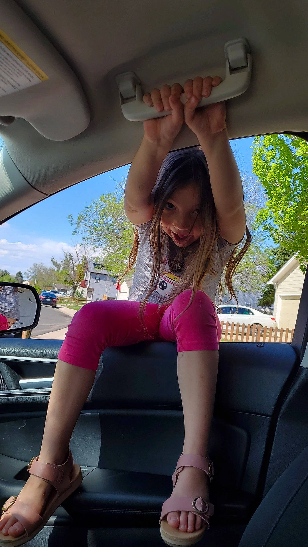 Aria is registered to the contest to win money with this photo: auto_part, automotive_design, automotive_exterior, automotive_lighting, automotive_mirror, beauty, car, fun, leisure, motor_vehicle, person, personal_luxury_car, pink, steering_wheel, summer, thigh, tints_and_shades, tree, vehicle, vehicle_door