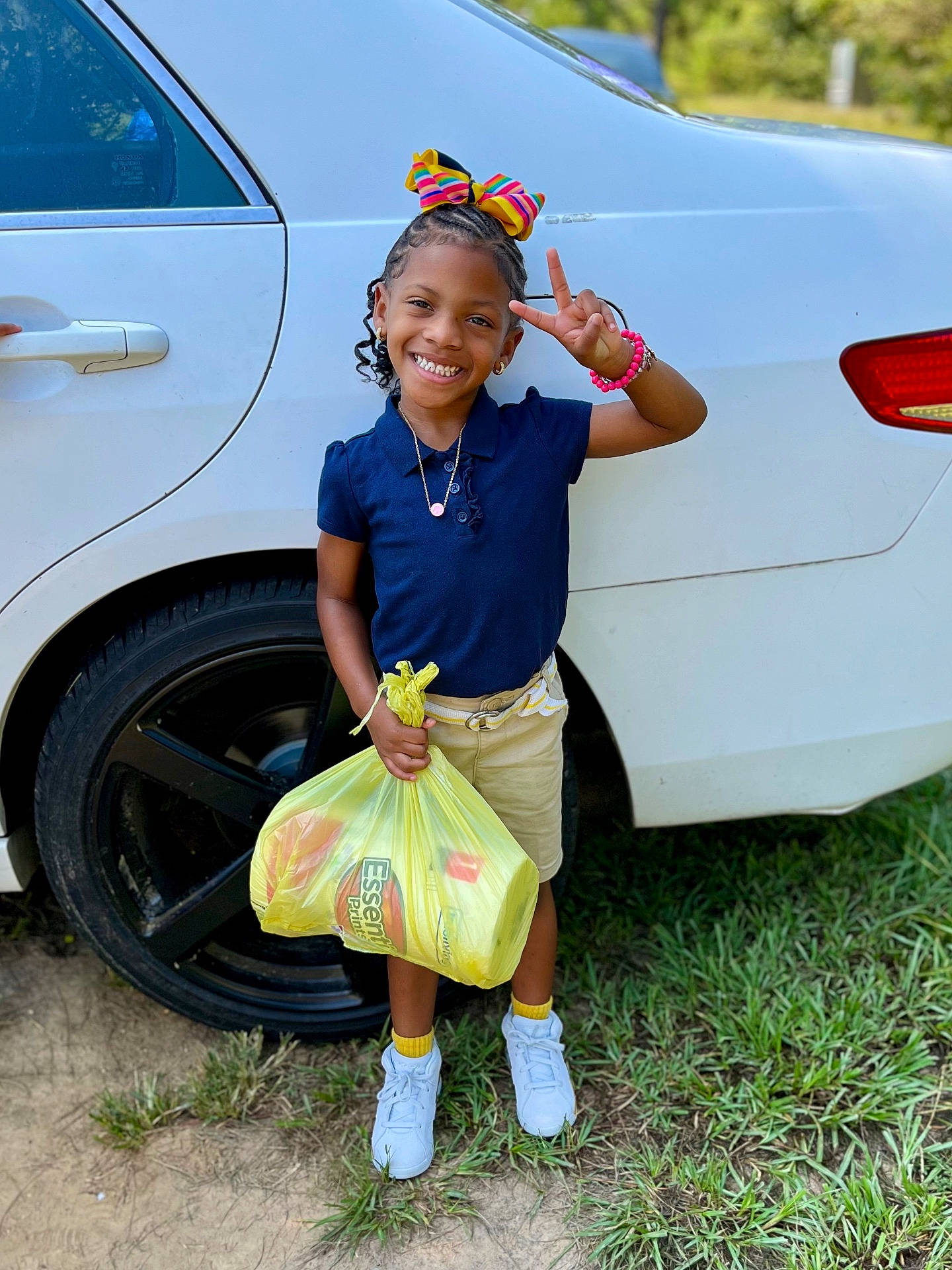 Aerial is registered to the contest to win money with this photo: accessories, alloywheel, car, carwheel, child, clothing, face, female, girl, jewelry, machine, necklace, person, sitting, sleeve, spoke, tire, transportation, vehicle, wheel