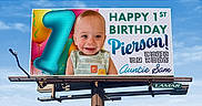 Pierson is registered to the contest to win money with this photo: baby, child, infant, birthday, first_birthday, billboard, advertisement, portrait, smiling, blue_sky, outdoor, colorful,  숫?