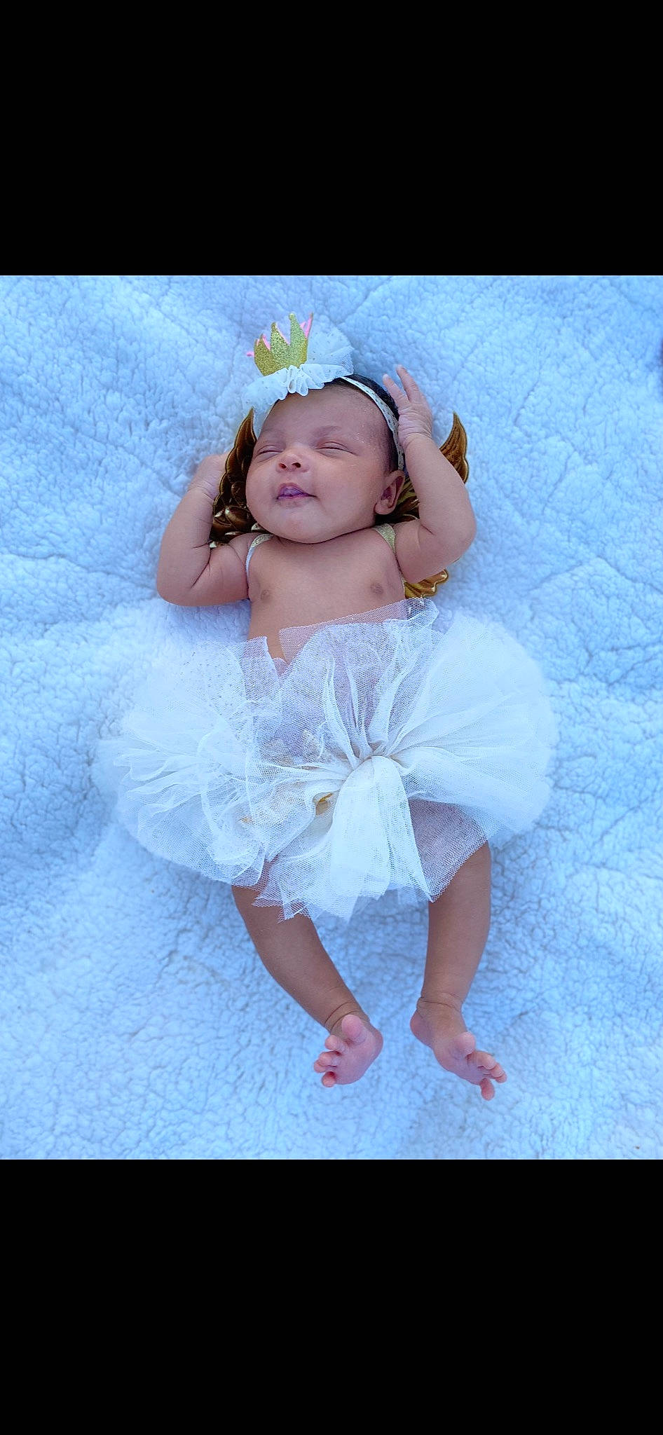 Kobi Milan is registered to the contest to win money with this photo: baby, baby_toddler_clothing, barefoot, bridal_accessory, embellishment, event, fashion_accessory, flash_photography, hair_accessory, happy, headband, headgear, headpiece, leg, person, petal, pink, purple, sitting, textile