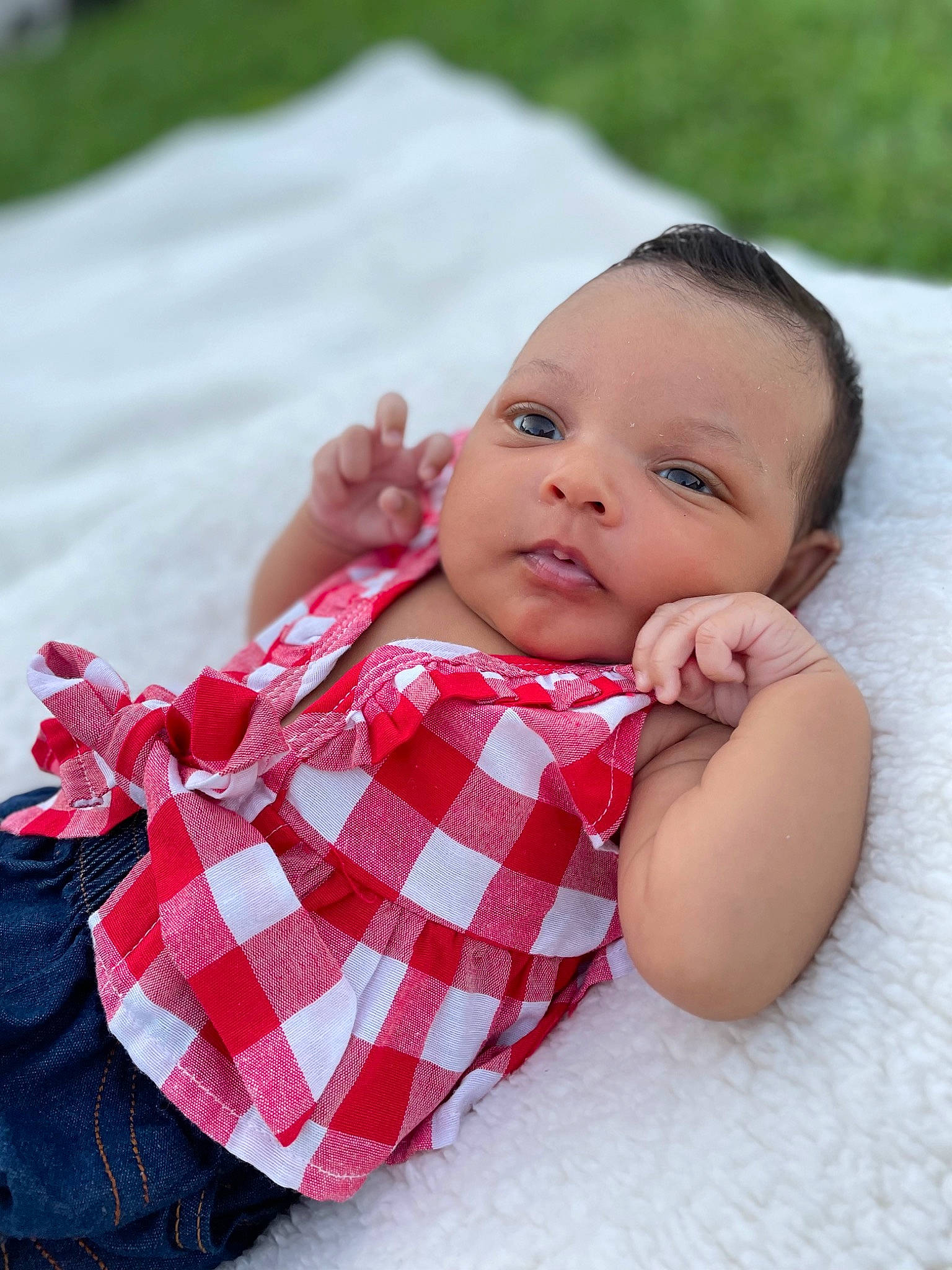 Kobi Milan is registered to the contest to win money with this photo: arm, baby, baby_toddler_clothing, cheek, collar, comfort, eye, finger, hand, happy, lip, mammal, person, pink, plaid, product, skin, sleeve, tartan, textile