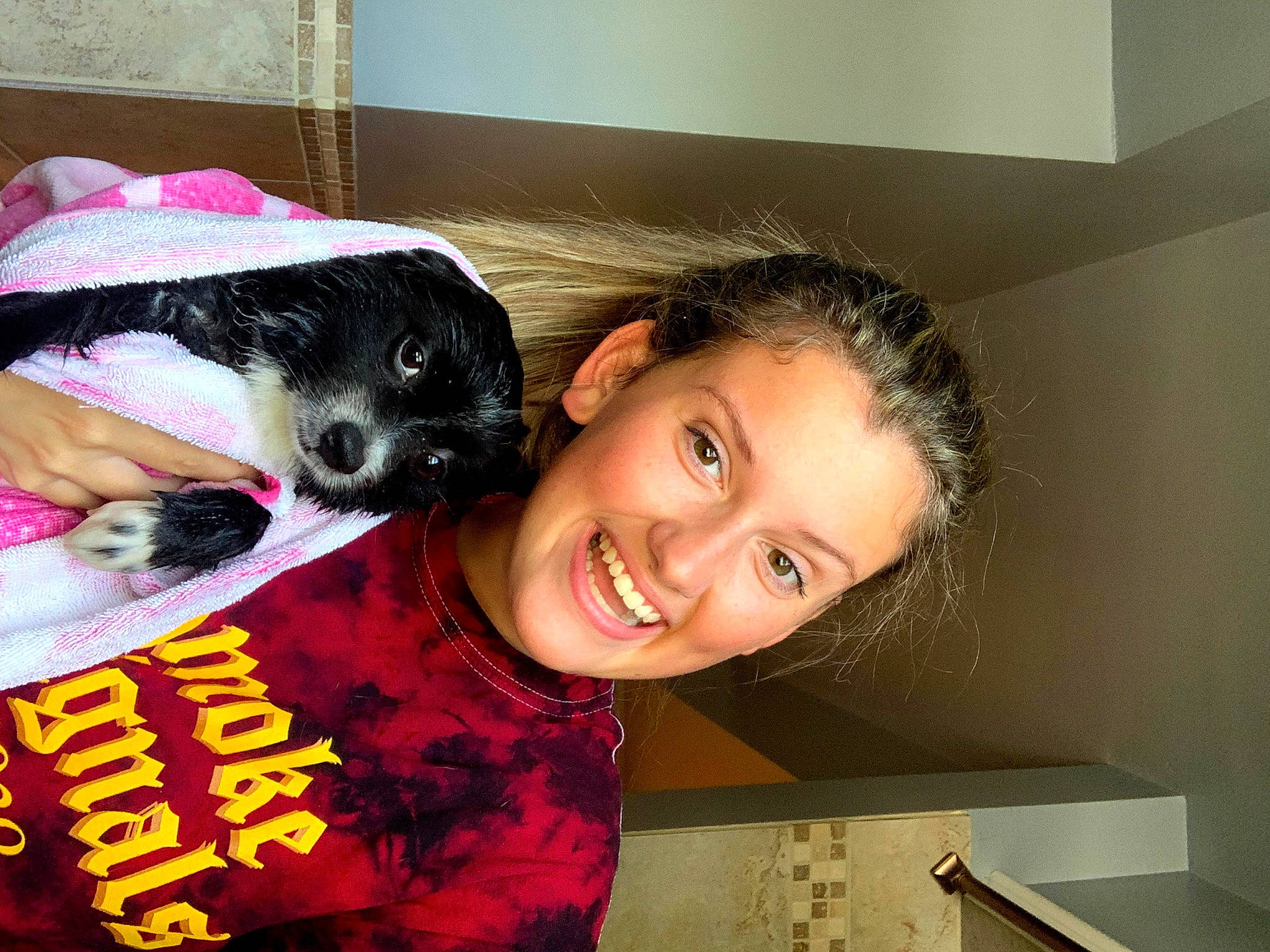 Huxleyhound is registered to the contest to win money with this photo: black_hair, carnivore, child, companion_dog, dog, dog_breed, dog_supply, eye, fun, fur, happy, magenta, pet_supply, pink, room, sleeve, smile, sporting_group, t_shirt, toy_dog