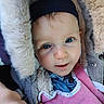 Camélia participe au concours pour gagner de l'argent avec cette photo : baby, child, face, blue_eyes, bib, clothing, cozy, cute, fluffy, hand, headwear, jacket, looking_at_camera, portrait, pink, skin, soft, warm, winter, young