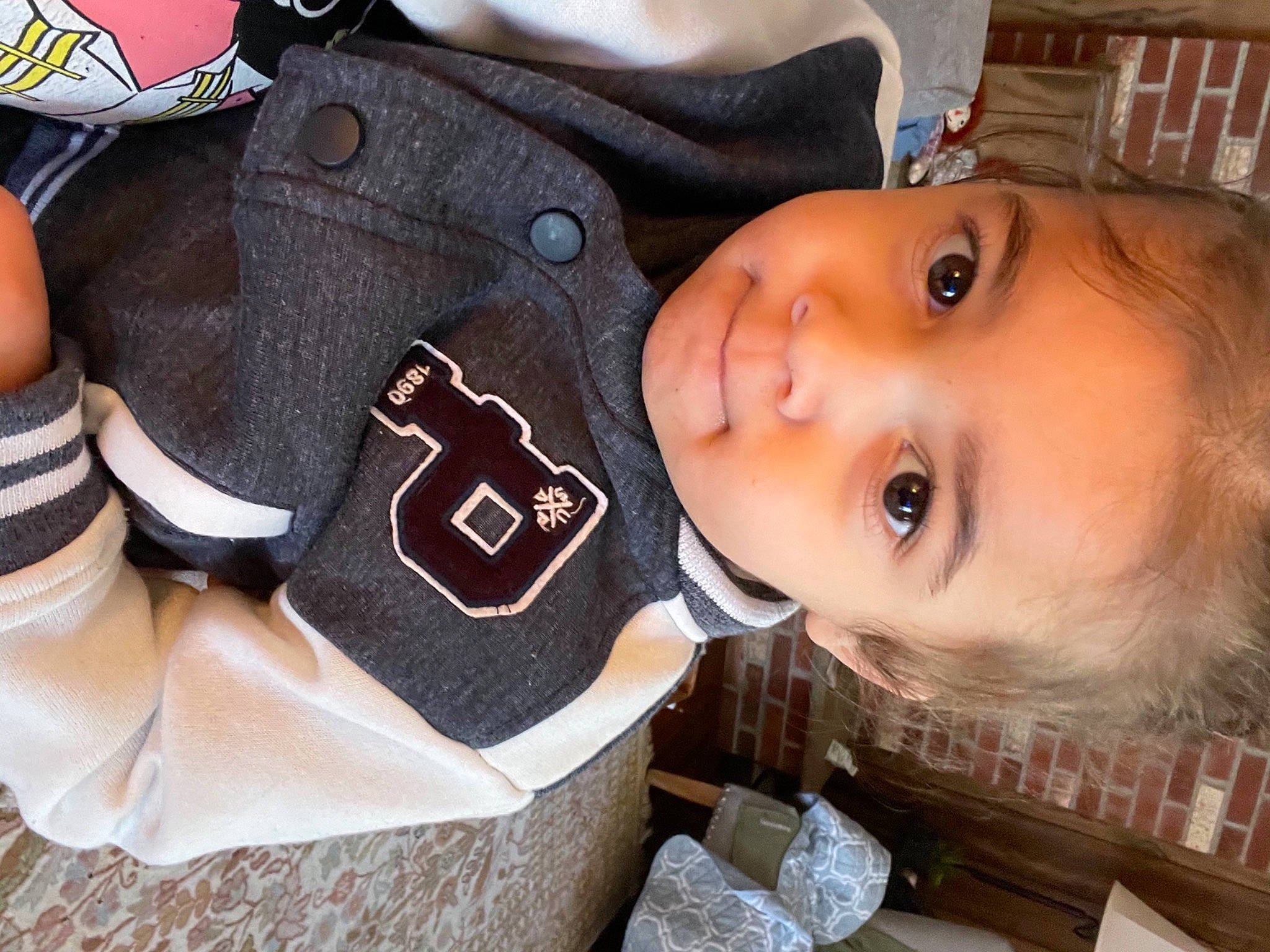 Marcel is registered to the contest to win money with this photo: cap, carmine, cheek, child, cool, eyelash, fashion_accessory, fur, gesture, happy, hat, jersey, lip, person, personal_protective_equipment, sleeve, sports_gear, toddler, uniform, white