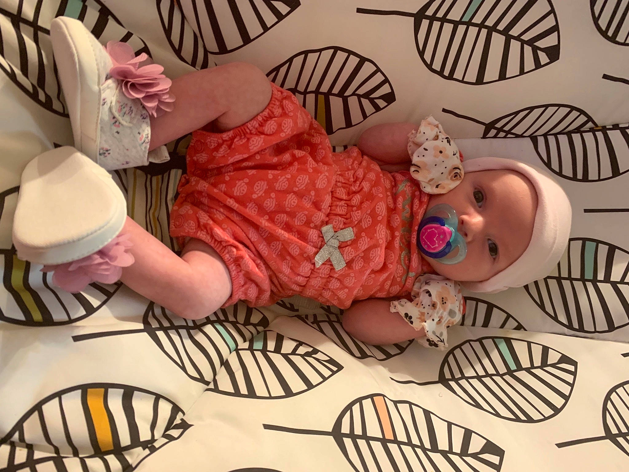 Skyla joined the competition — help win amazing prizes! baby, baby_toddler_clothing, clothing, comfort, eyelash, finger, hand, hat, headgear, headwear, human_body, organ, pattern, person, pink, skin, sleeve, snapshot, tableware, textile